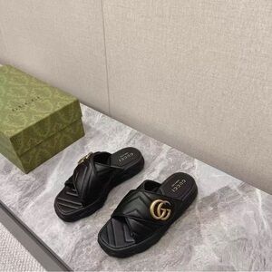 Gucci Black Slippers with Gold Accent